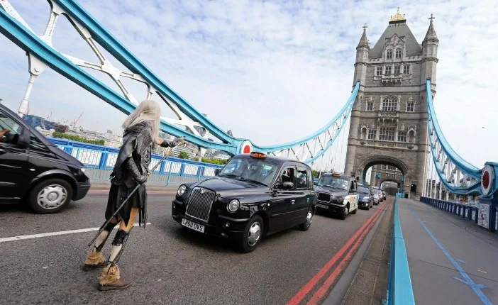 A Whitewalker stops traffic over London Bridge to celebrate the release of Game of Thrones Season 5 on Digital HD